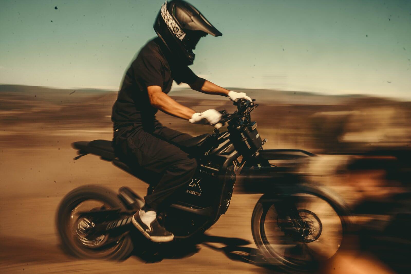 Vtron motorcycle and rider on a dirt trail